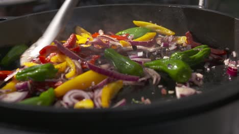 Close-up-shot-of-a-pot-of-vegetables-being-stirred-while-cooking