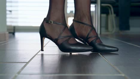 Woman-presents-her-sexy-high-heels-in-the-catwalk-silently-in-the-apartment-filmed-from-the-floor-closeup