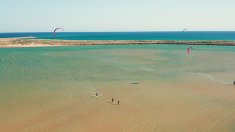 Aerial:-Aquaculture-and-kitesurfing-in-the-lagoon-of-Alvor-in-Portugal