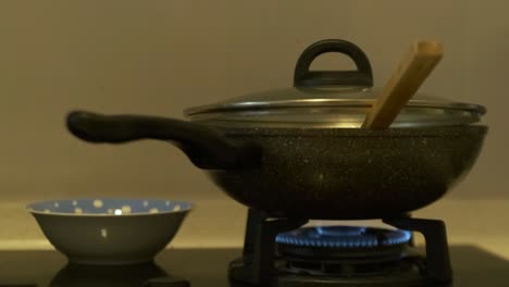 Closeup-of-Stove-cooking-food-in-pot-in-kitchen-at-home