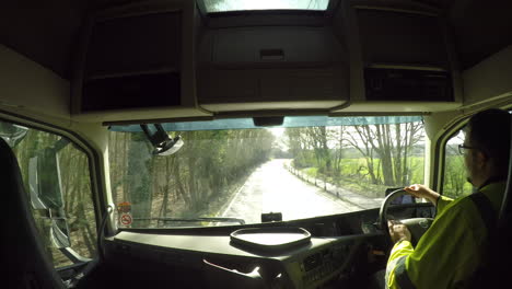 In-cab-view-of-a-HGV-driver-on-a-wooded-country-road-with-no-other-traffic