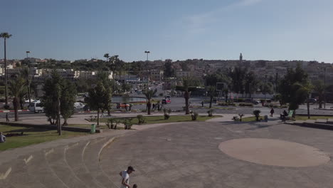 Wide-view-of-the-Meknes-medina-from-a-square-facing-it,-roundabout-with-heavy-traffic