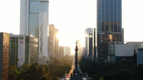Aerial-footage,-Paseo-de-la-Reforma-street-and-monument-of-Victoria-Alada-of-Mexico-City