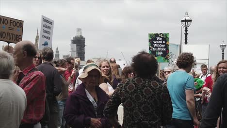 SLOW-MOTION-clips-of-climate-change-protestors-lobbying-along-the-banks-of-the-Thames-and-outside-Parliament