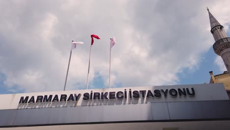 Turkish,State-railways,ministry-of-Communicaiton-flags-wave-on-top-of-Marmaray-Sirkeci-Station-locates-in-Istanbul,Turkey