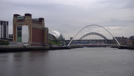 Zoomed-in-view-of-the-Baltic-arts-center,-Sage-theater-and-Millenium-bridge-in-Newcastle-upon-Tynes-historic-riverside-on-an-overcast-day