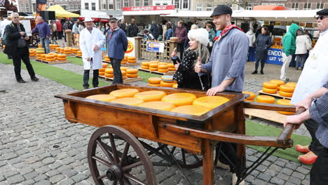 People-walking-on-square-while-cheese-fair-in-Gouda