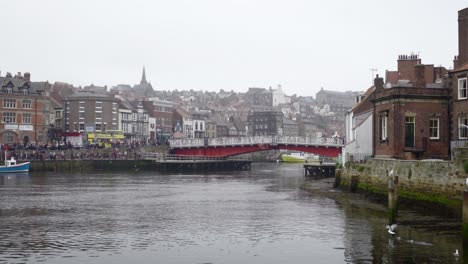 Slow-reveal-of-swing-bridge-and-adjacent-harbour-buildings-at-Whitby,-on-the-North-Yorkshire-coast