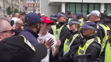 Tommy-Robinson-supporters-argue-with-police-near-the-BBC-studio-in-London
