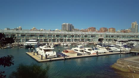 Waterfront-apartment-blocks-with-boats-parked-by-the-wharf