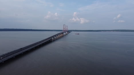 aerial-view-of-the-Suramadu-bridge,-the-longest-bridge-in-Indonesia-connecting-the-islands-of-Java-and-Madura