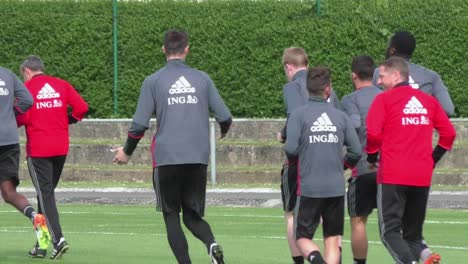 Dries-Mertens-being-hugged-by-assistant-coach-of-Red-Devils-at-training-placement-in-Knokke,-Belgium