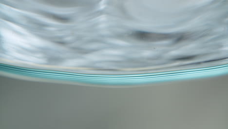 Mesmerizing-abstract-shot-of-water-getting-filled-into-a-glass
