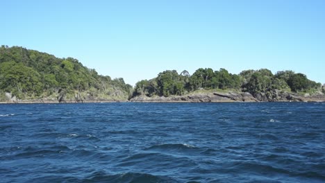 Wide-angle-view-of-rock-islands-with-trees-on-the-in-the-deep-blue-Pacific-Ocean