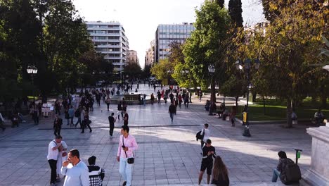 People-walking-on-Syntagma-Square-near-fountain-on-sunny-day