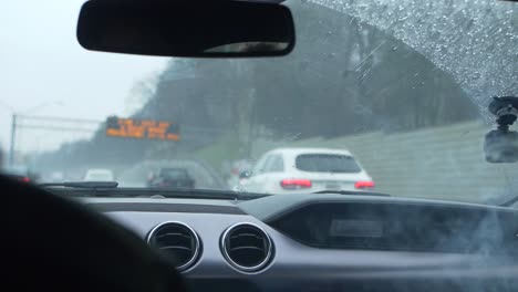 smoking-marijuana-in-car-on-rainy-highway-slow-motion