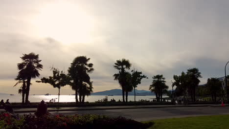 Sunset-shadows-of-cyclists-and-people-on-bikes-ride-from-the-downtown-roadway-of-Burard-Bridge,-Sunset-Beach,-English-Bay-to-Stanley-park-while-cars-are-restricted-due-to-covid-19-pandemic