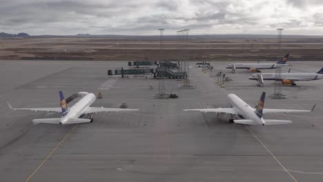 Two-Boeing-757-from-Icelandair-parked-on-tarmac-of-Iceland-airport-rising-aerial