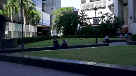 Office-workers-taking-a-break-at-Raffles-Place,-Singapore