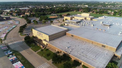 Aerial-video-flying-over-the-parking-lot-and-Keller-High-School