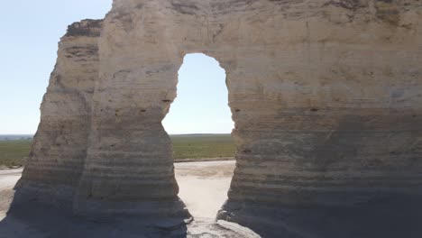 Monument-Rocks-in-Kansas-fly-through-hole-in-rocks-shot