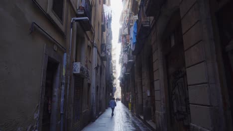 Walking-the-narrow-back-alleys-of-El-Raval-Barcelona-Spain