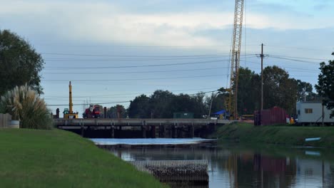 Construction-Crew-Working-Repair-Bridge-Over-Canal
