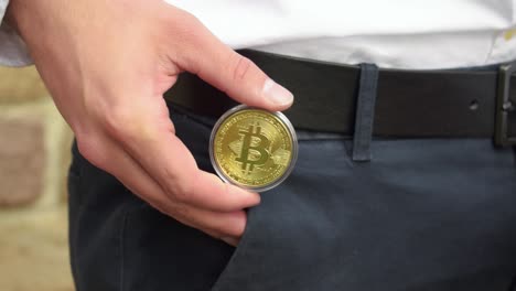 Professional-Businessman-With-White-Shirt-Gets-An-Golden-Bitcoin-Out-Of-His-Pocket