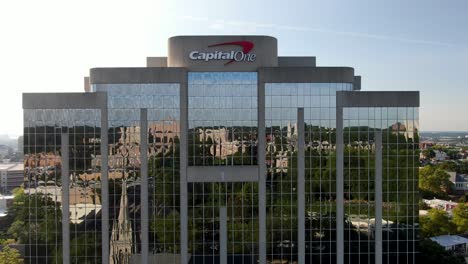 Rising-aerial-reveals-Capital-One-Bank-headquarters-office-building,-home-of-consumer-banking-in-United-States