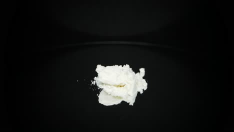 Addictive-cocaine-illegal-drug-product-on-black-turntable