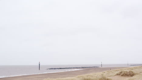 UK-English-Norfolk-beach-seaside-in-stormy-weather-with-rocks-for-coastal-sea-preservation-and-conservation