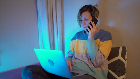 Customer-service,-talking-on-the-phone-in-front-of-the-computer-and-sitting-on-the-bed