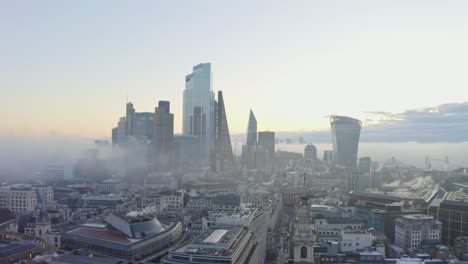 Stable-aerial-shot-of-London-Central-business-district-foggy-sunrise