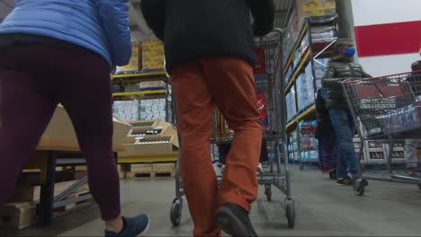 Low-Angle-POV-From-Moving-Shopping-Trolly-Through-Fruit-And-Vegetables-At-Costco