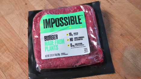 Rotating-shot-of-Impossible-Burger-package-of-vegan-meat