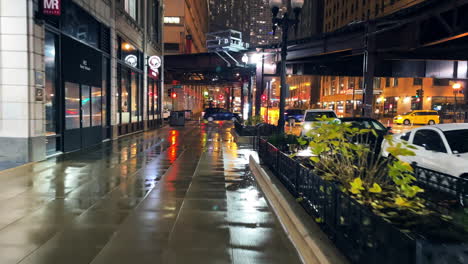 City-walk-in-Chicago-wet-streets-at-late-night-hours-during-rainy-evening