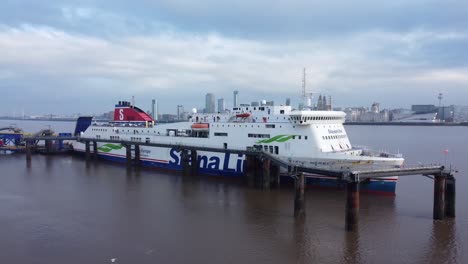 Stena-Line-freight-ship-vessel-loading-cargo-shipment-from-Wirral-terminal-Liverpool-aerial-view-low-angle-rising