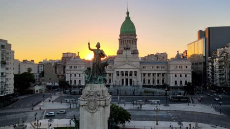 Aerial-dolly-over-Congressional-Plaza-and-monument-leading-to-Argentine-Congress-building-at-sunset,-Buenos-Aires