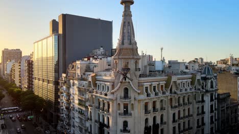Aerial-orbit-of-El-Molino-historic-Art-Nouveau-building-recently-restored-in-busy-Buenos-Aires-at-golden-hour,-Argentina