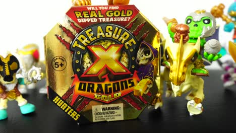 Camera-slowly-zooming-out-to-show-the-Treasure-X-Dragons-Gold-toy-box-with-mini-figures-surrounding-it