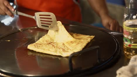 Preparation-of-tasty-Thai-Roti-banana-pancake