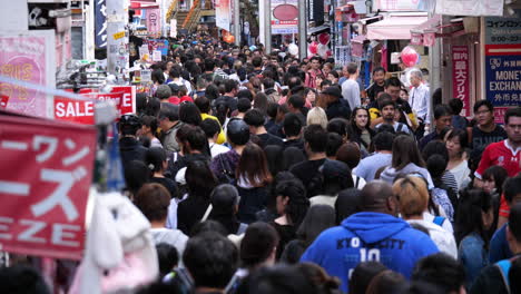 Static-shot-of-a-large-crowd,-walking-on-the-streets-of-Harajuku,-in-Shibuya,-Tokyo,-Japan