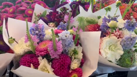 POV-shot-of-someone-walking-through-Pike's-Market-and-admiring-the-beautiful-flower-bouquets-ready-for-sale