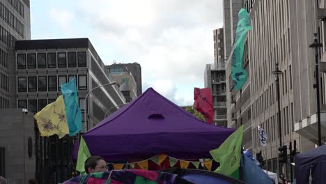 Extinction-Rebellion-flags-fly-during-the-protests-in-London,-UK