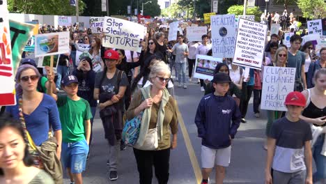 Crowd-marching-in-street-against-climate-change