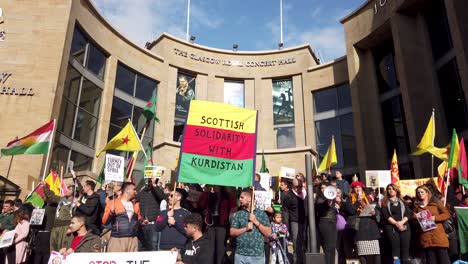 Close-up-of-people-protesting-against-the-Turkish-occupation-and-ethnic-cleansing-of-the-Kurds-in-Glasgow