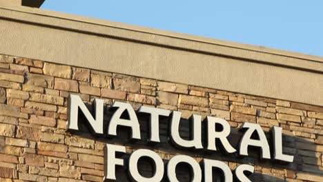 Natural-Foods-Retail-Sign-on-Building-Pan-Down-From-Sky