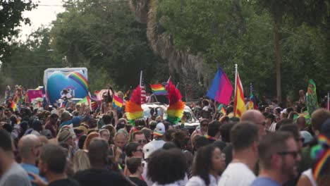 People-Marching-in-Street-at-River-City-Pride-Parade-With-Equality-and-LGBTQ-Flags-in-Jacksonville,-FL