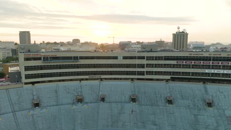 Aerial-truck-right,-large-grandstand-seating-area,-Camp-Randall-Stadium,-Madison,-Wisconsin