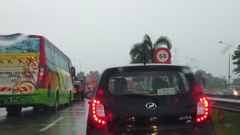 Footage-of-cars-stuck-on-a-traffic-with-a-bad-weather-on-the-road-while-travelling